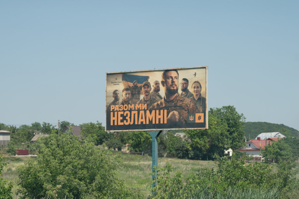 Ellen De - Quiet Resistance - Board highway transit landscape Ukraine