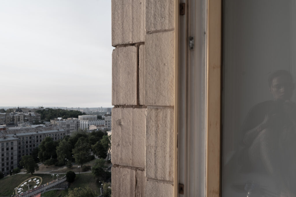 Ellen De - Quiet Resistance - Window reflection self portrait Kyiv
